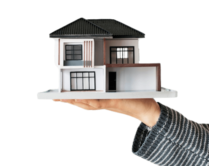 Hand holding a modern house model